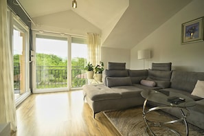 Villa | Living area | 36-inch flat-screen TV with cable channels