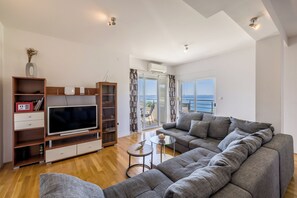 Superior Apartment | Living area | 36-inch flat-screen TV with cable channels