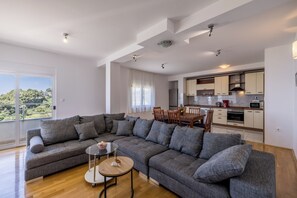 Superior Apartment | Living area | 36-inch flat-screen TV with cable channels