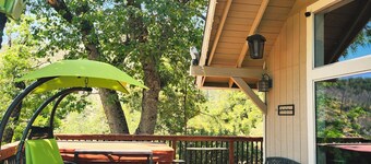 2 Br 2 Ba upstairs in  cabin w/hot tub on 5.6 acre. Next to a Creek /near a lake