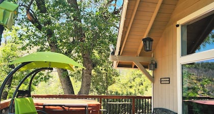 2 Br 2 Ba upstairs in cabin w/hot tub on 5.6 acre. Next to a Creek /near a lake