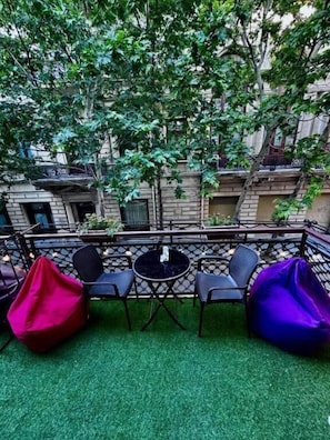 Deluxe Triple Room, Balcony, City View | Terrace/patio