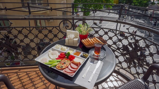 Deluxe Triple Room, Balcony, City View | Breakfast meal - Nizami Boutique Hotel (Baku)