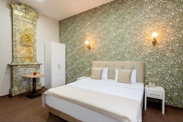 Deluxe Triple Room, Balcony, City View | Minibar, in-room safe, soundproofing, iron/ironing board