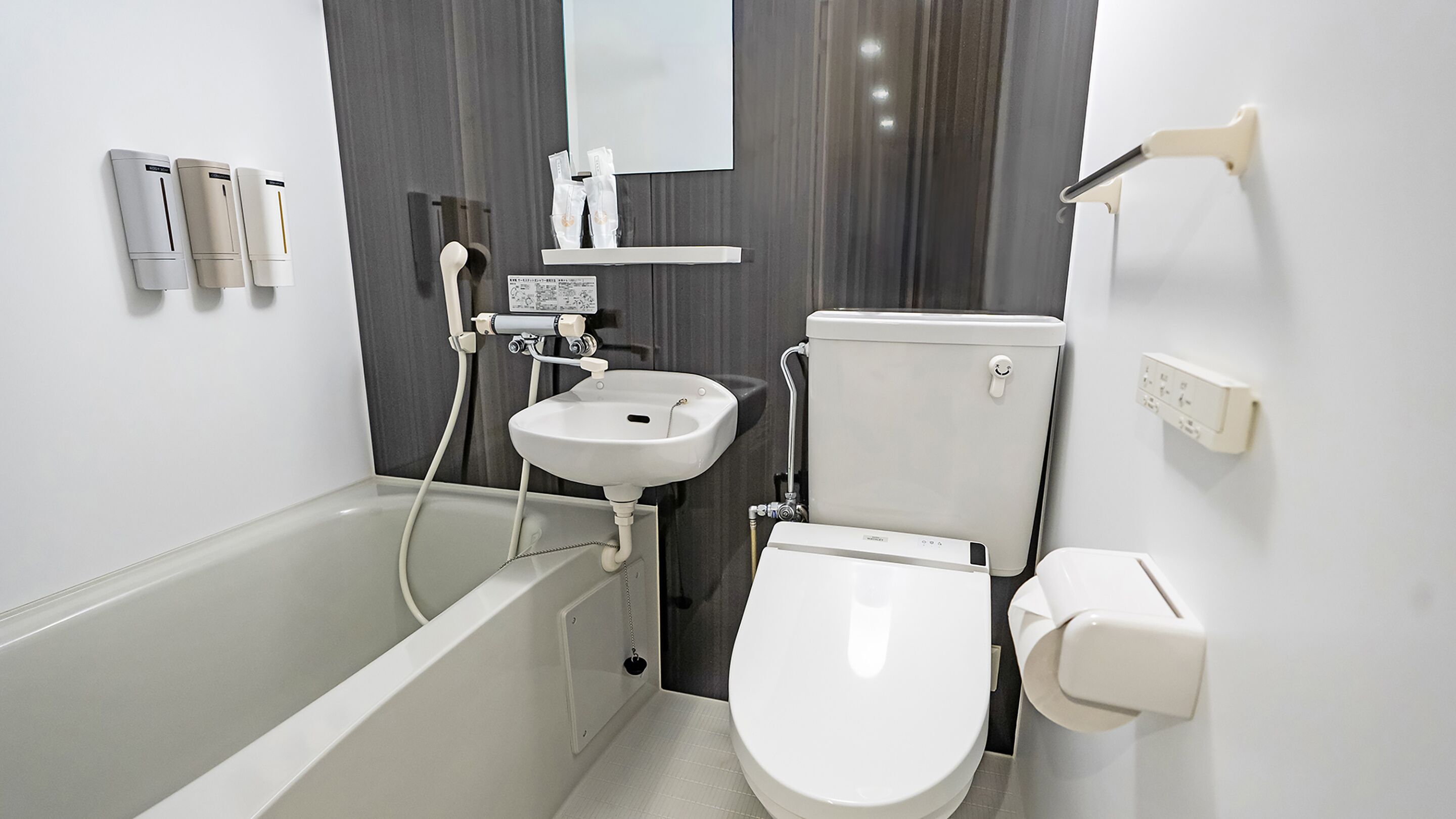 Combined shower/tub, hair dryer, slippers, towels