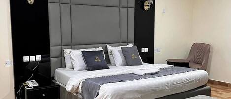 Deluxe Room, Balcony, City View | Desk, laptop workspace, blackout drapes, soundproofing