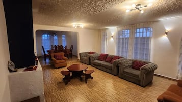 Family Bungalow, Balcony, Garden View | Living area | 32-inch Smart TV with digital channels