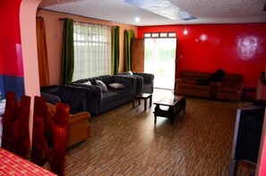 Family Bungalow, Balcony, Garden View | Living area | 32-inch Smart TV with digital channels - Serian Vacation House (Narok)
