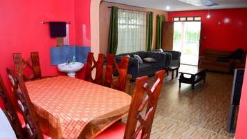 Family Bungalow, Balcony, Garden View | Living area | 32-inch Smart TV with digital channels