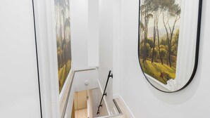 A staircase with a painting of a forest scene on the walls. - Charming Duplex - 2br/6p - Saint Germain (Paris)