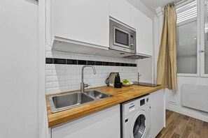 Microwave, stovetop, coffee/tea maker, toaster