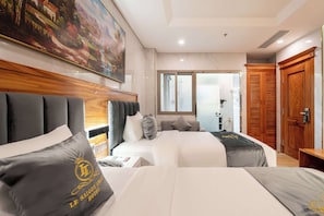 Roba de llit d'alta qualitat, minibar i caixa forta a l'habitació