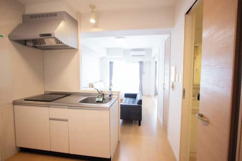 Family Apartment | Private kitchen | Fridge, microwave, electric kettle, cookware/dishes/utensils