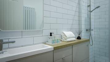 Shower, towels, soap, toilet paper