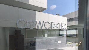 A modern building with a glass facade and the words "CO WORKING" prominently displayed. - Modern studio apartment with private terrace and excellent communal areas (San Sebastián de los Reyes)