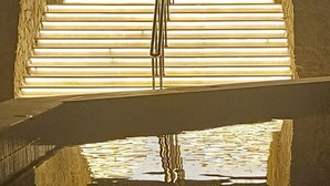 A set of stairs leading up to a brightly lit area with a reflective pool at the bottom. - Rosetta Hotel & SPA (Sharm El Sheikh)