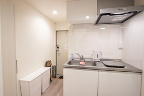 Standard Apartment | Private kitchenette | Fridge, microwave, electric kettle, cookware/dishes/utensils - HOTEL FAMILIA Hakata East (Fukuoka)