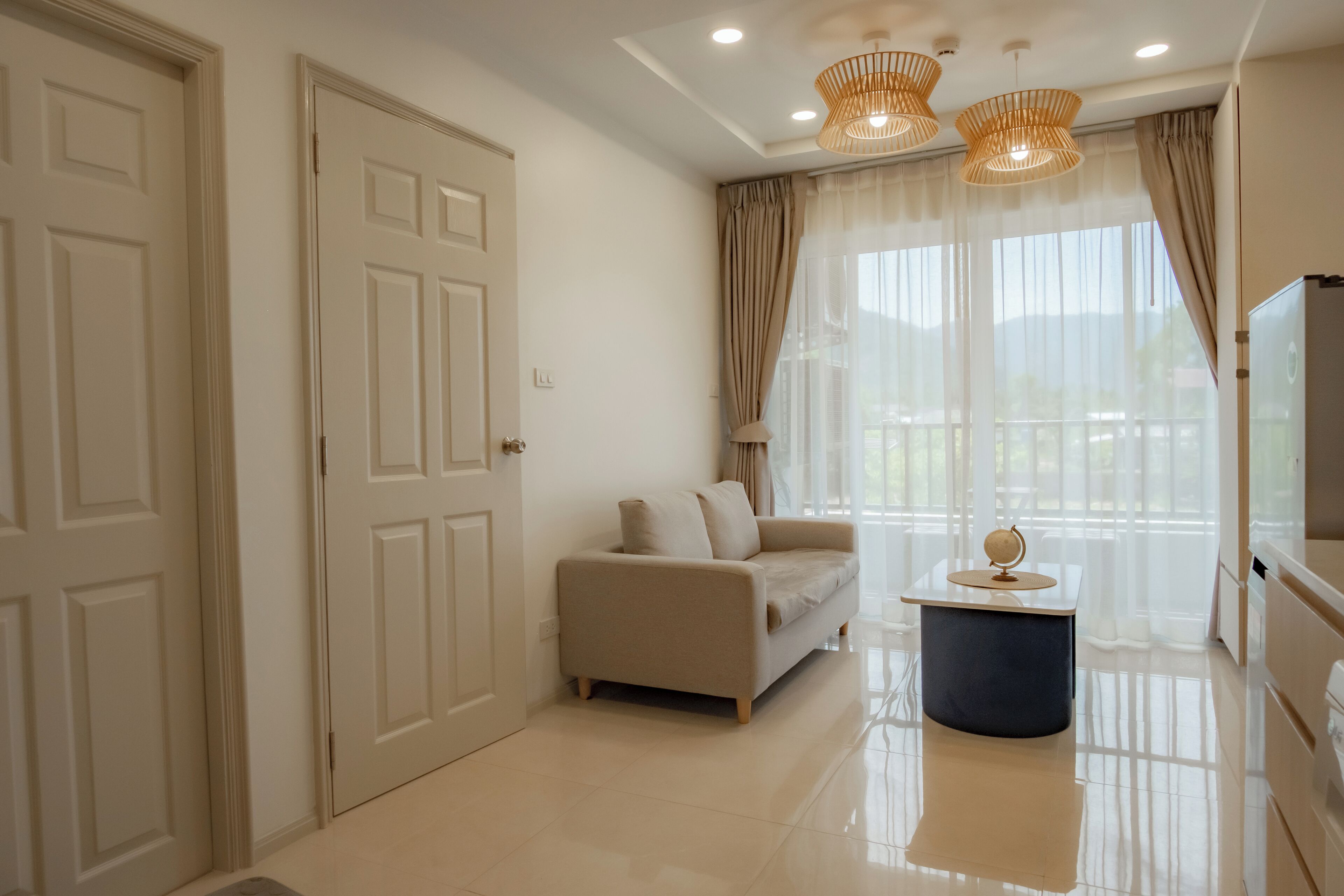 Deluxe Condo, 1 King Bed | Living area | 45-inch Smart TV with digital channels