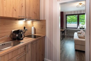 Fridge, stovetop, coffee/tea maker, cookware/dishes/utensils