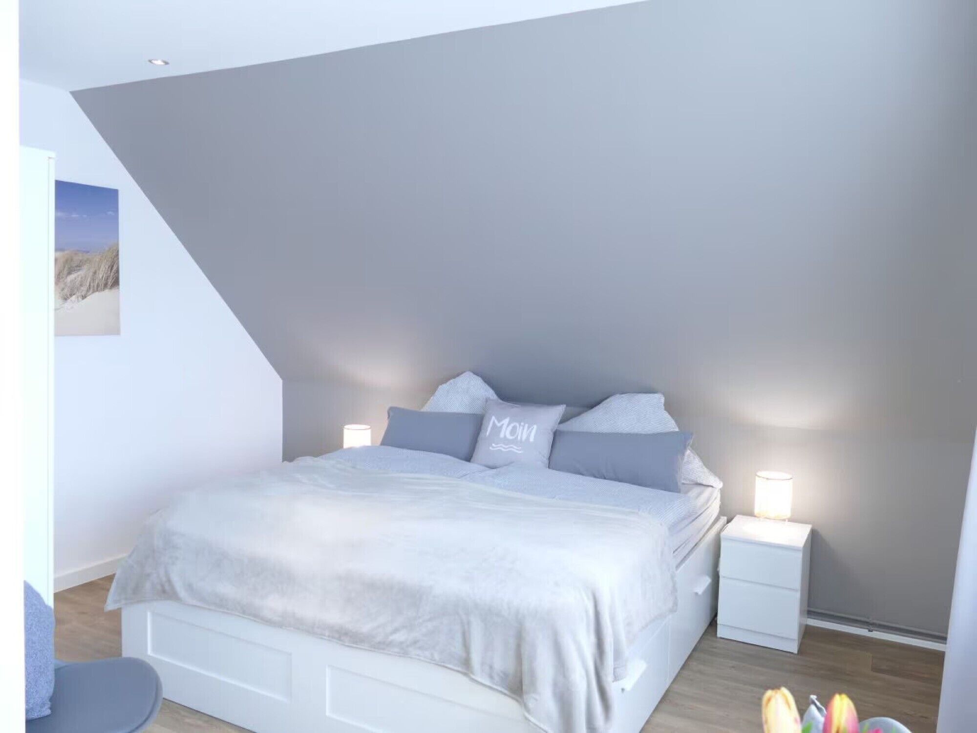 A bedroom with a bed, bedside tables, and a nightstand.