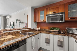 Fridge, microwave, stovetop, coffee/tea maker