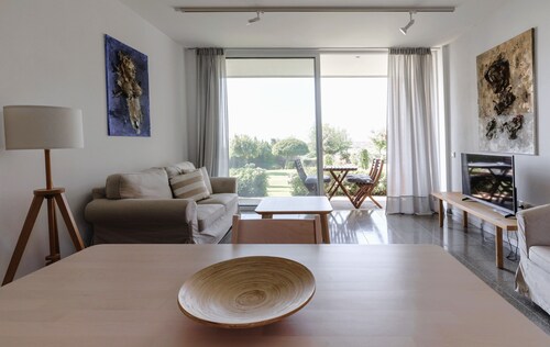 Eucrasia | One-Bedroom Apartment, Art by PraXis Apartments