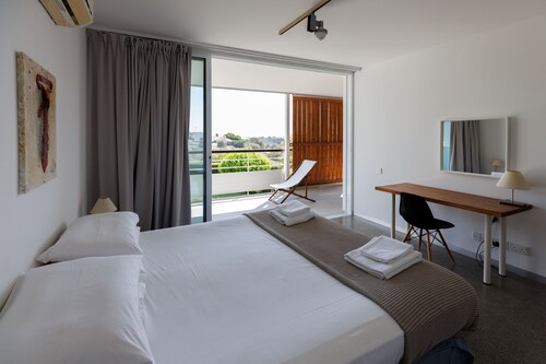 Euploia | One-Bedroom Apartment, Art by PraXis Apartments