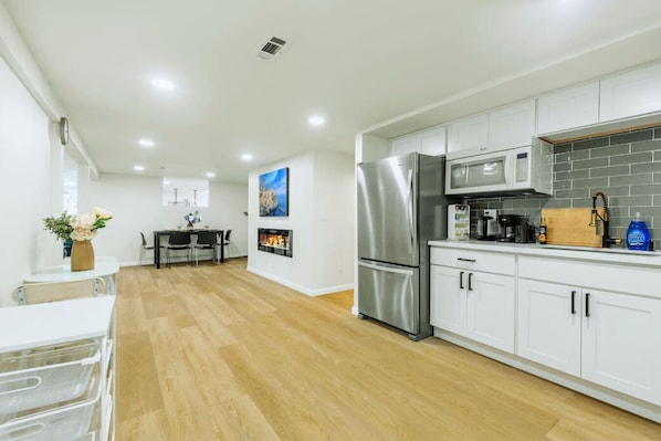 Fridge, microwave, stovetop, coffee/tea maker