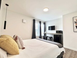 1 bedroom, desk, iron/ironing board, travel crib