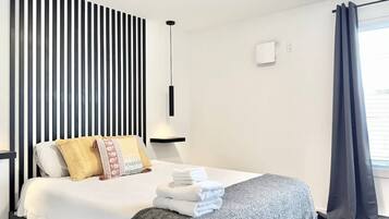 1 bedroom, desk, iron/ironing board, travel crib