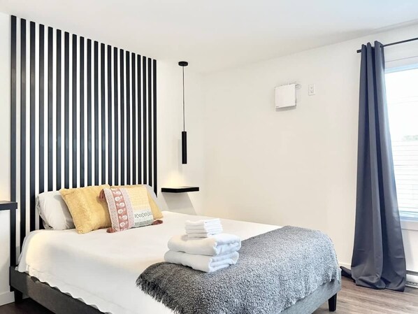 1 bedroom, desk, iron/ironing board, travel crib