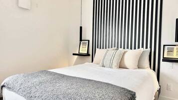 1 bedroom, desk, iron/ironing board, travel crib