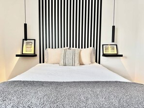 1 bedroom, desk, iron/ironing board, travel crib