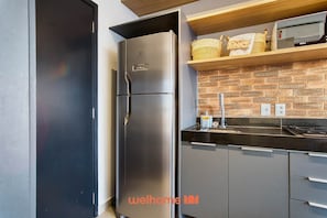 Fridge, microwave, stovetop, coffee/tea maker