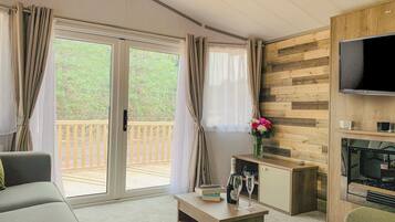 Exc 4 Berth waterside lodge Hot Tub | Living area | 32-inch LCD TV with digital channels