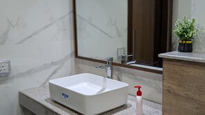Shower, hair dryer, towels, soap