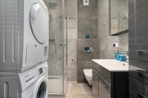 Shower, hair dryer, towels, shampoo