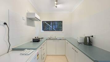 Fridge, stovetop, toaster, cookware/dishes/utensils