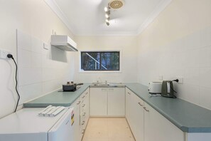 Fridge, stovetop, toaster, cookware/dishes/utensils