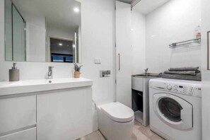 Shower, hair dryer, towels