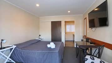 Studio, 1 King Bed, Non Smoking | In-room safe, desk, laptop workspace, iron/ironing board
