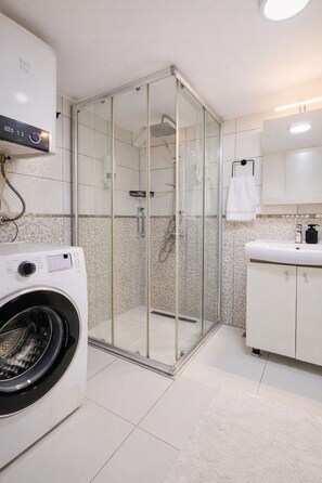 Hair dryer, towels, soap, shampoo