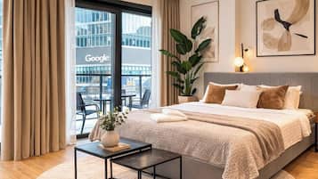 Deluxe Studio, Courtyard View | Laptop workspace, blackout drapes, soundproofing, iron/ironing board