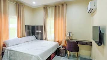 Economy Apartment, Balcony, City View | Desk, laptop workspace, blackout drapes, soundproofing