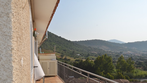 A balcony with a view of a hilly landscape. - Fta-bel02 APT 6 PAX Vicino AL Mare (Budoni)