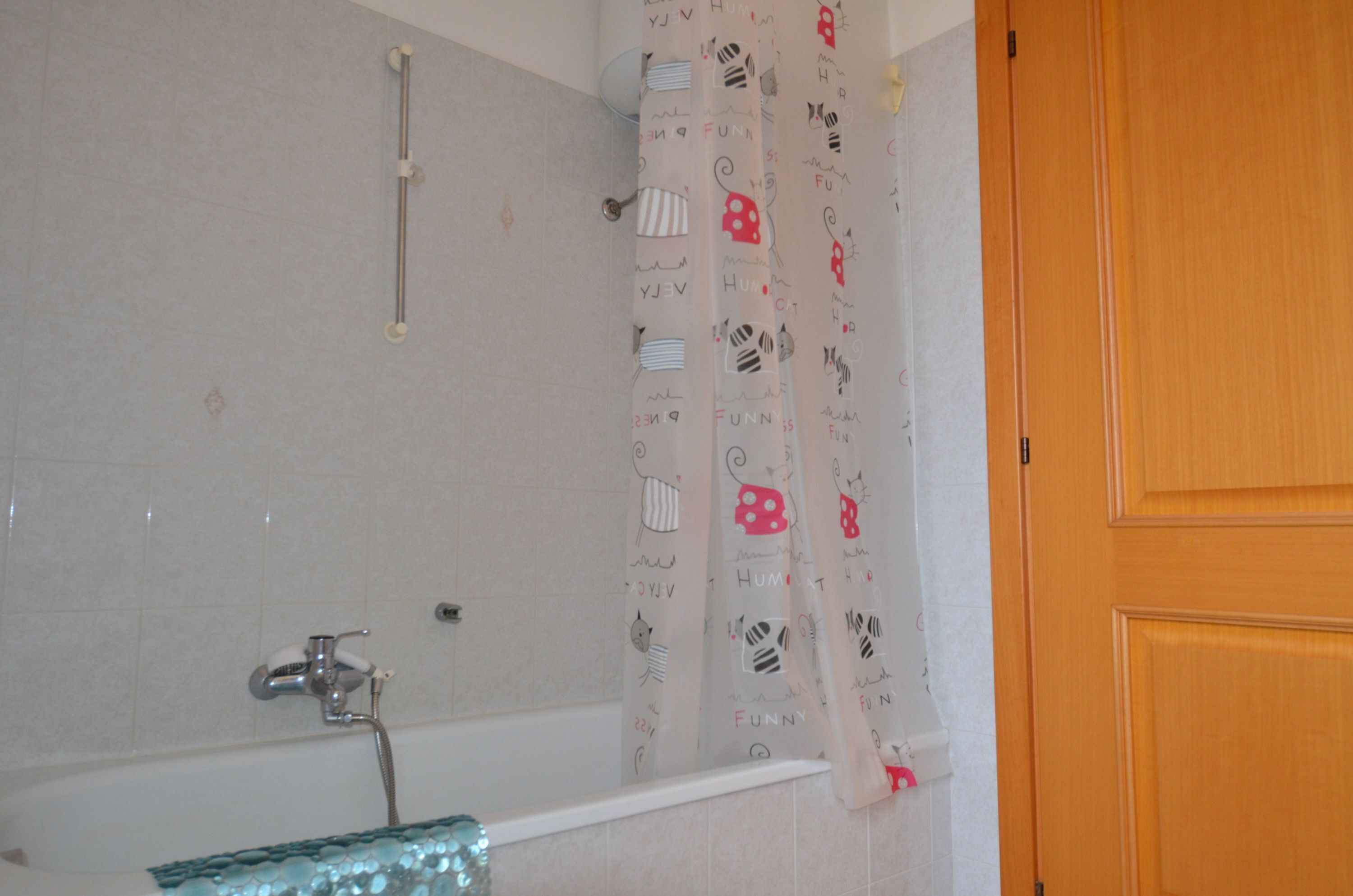 A bathroom with a shower, a bathtub, and a toilet.