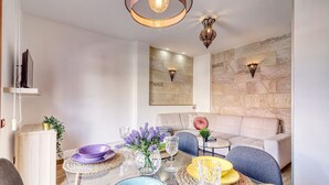 A modern living room with a sofa, coffee table, and decorative items. - Retreat w Ocean Views Private Parking Ensuite (Los Realejos)