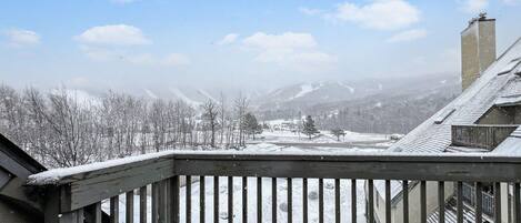 A snowy mountain landscape with a clear sky.