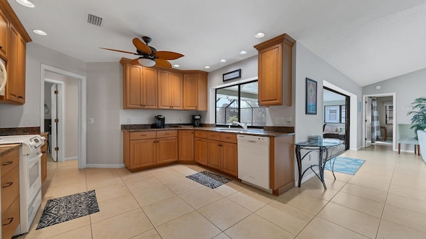 Dishwasher, paper towels, dining tables
