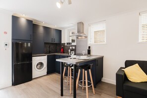 Fridge, oven, coffee/tea maker, toaster